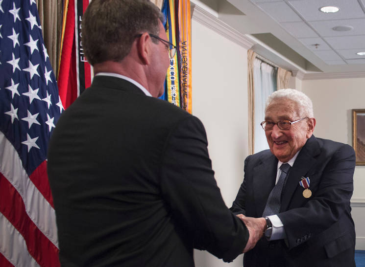 May 9, 2016 - Defense Secretary Ash Carter shakes former Secretary of State Henry A. Kissinger's hand during an award ceremony at the Pentagon honoring Kissinger for his years of distinguished public service, . Kissinger received the Department of Defense Distinguished Public Service Award. (DoD photo by Air Force Senior Master Sgt. Adrian Cadiz)