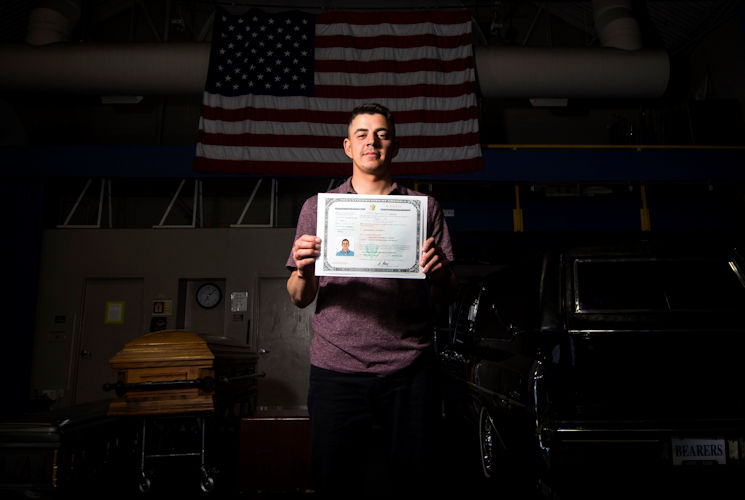 April 20, 2017 - Jose Velazquez, U.S. Air Force Honor Guard firing party member, holds his citizenship paperwork inside Ceremonial Hall at Joint Base Anacostia-Bolling, District of Colombia. Velazquez came to America with his parents at a young age and gained citizenship after completing Air Force basic training. (U.S. Air Force photo by Senior Airman Philip Bryant)