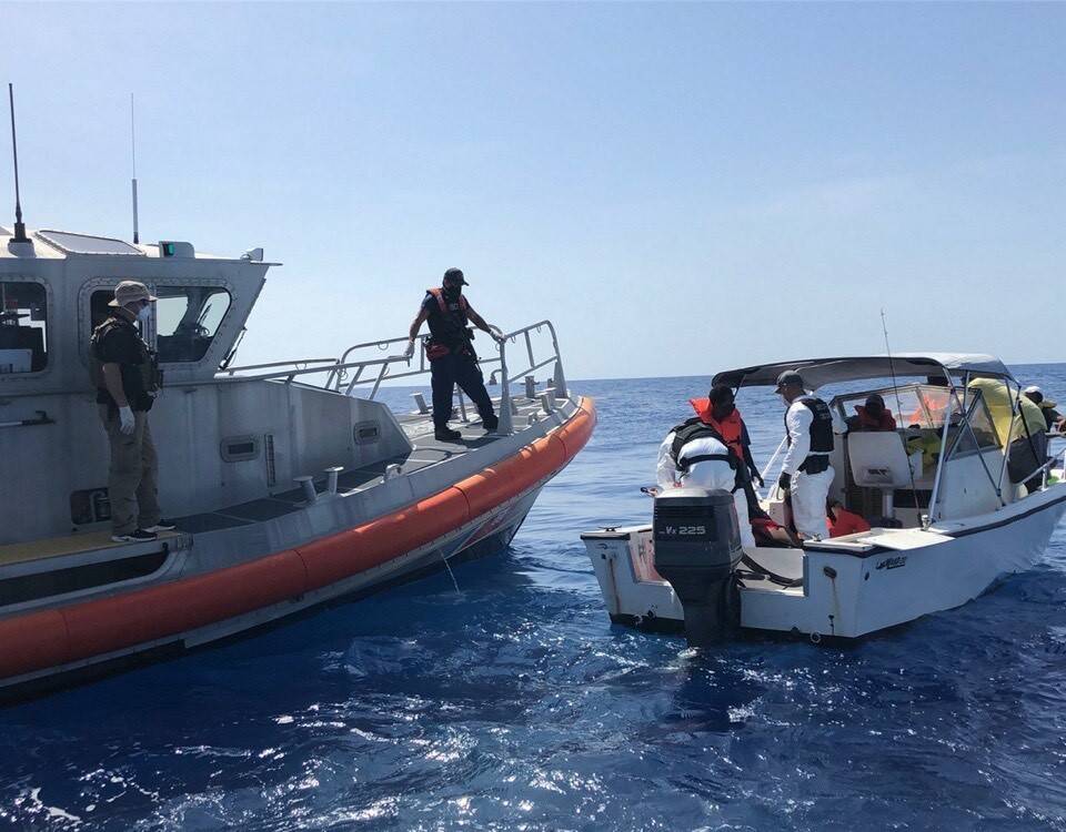 July 2, 2020 - A Coast Guard Station Fort Pierce 33-foot Special Purpose Craft-Law Enforcement crew embarks illegal migrants approximately 26 miles east of St. Lucie, Florida. (Coast Guard photo)