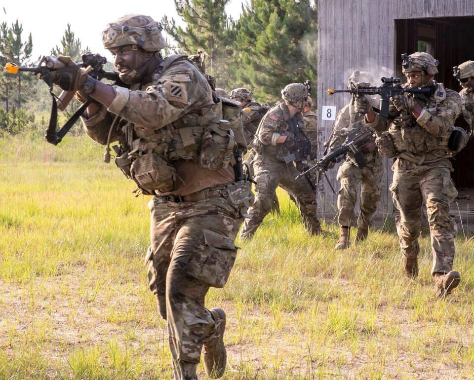 June 21, 2022 - Georgia Army National Guard Infantrymen with the Lawrenceville-based Alpha Company, 1st Battalion, 121st Infantry Regiment, conduct urban attack training during Exportable Combat Training Capabilities (XCTC) Exercise at Fort Stewart, Georgia. The XCTC exercise includes approximately 4,400 brigade personnel throughout Georgia. (Image created by USA Patriotism! from U.S. Army Sgt. Tori Miller.)