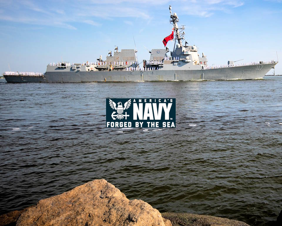 April 27, 2022 - A rocky shore view of the Arleigh Burke-class guided-missile destroyer USS Paul Ignatius (DDG 117) departing Naval Station Mayport Paul Ignatius in Florida to its new homeport Naval Station Rota in Spain. (Image created by USA Patriotism! from U.S. Navy photo by Mass Communication Specialist 2nd Class Juel Foster.)