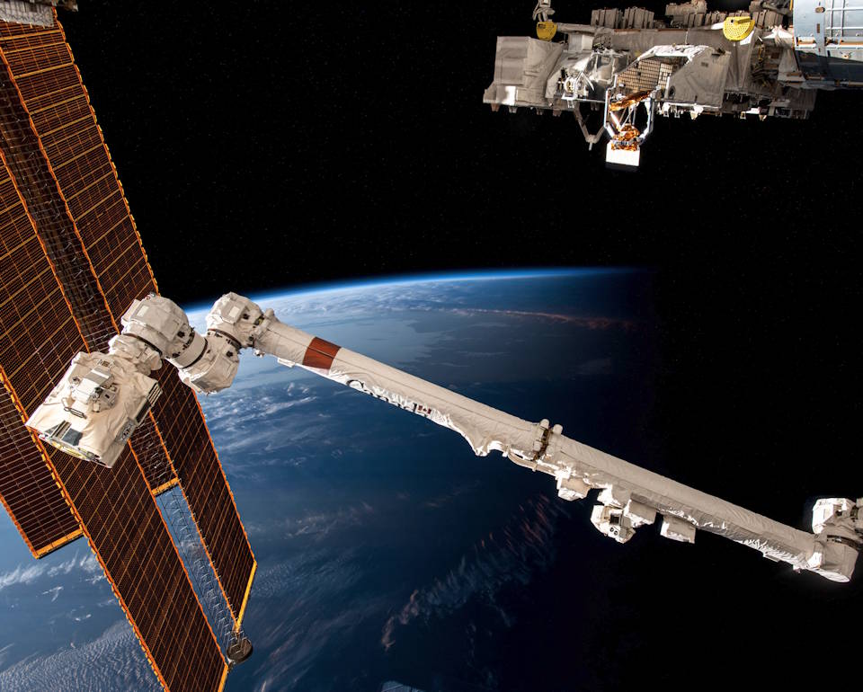 September 5, 2023 - The International Space Station (ISS) soars 266 miles above the coast of Argentina near the Rio de la Plata as it flies into an orbital sunset. In the foreground from left are, the station's main solar arrays, the Canadarm2 robotic arm, and the Kibo laboratory module's external research platform. (Image created by USA Patriotism! from NASA’s Johnson Space Center courtesy photo.)