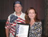 Branson, MO (July 8, 2010) -- After the Presleys Country Jubilee show . . . David Bancroft (founder of USA Patriotism!) presents a signed printing of his poem, In The Heart Of America, about Branson to Mayor Raeanne Presley.  Mayor Presley is married to Steve Presley, the drummer and one of the original members of the Presleys Country Jubilee, which is the longest running live show in Branson.