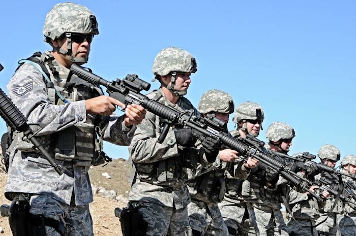 Guardsmen of the 124th Security Forces Squadron learn proper techniques and play out scenarios during a Shoot, Move, Communicate course. The specialized training took place at the Orchard Combat Training Center near Gowen Field, Idaho, May 5, 2013. (Air National Guard photo by Tech. Sgt. Becky Vanshur)