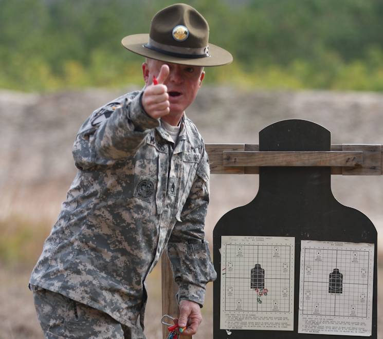 December 5, 2014 - Staff Sgt. Aaron Matthers, 108th Training Command (IET), provides marksmanship instruction to individual augmentees in preparation for upcoming mobilizations and deployments. Matthers and other mobilized instructors with the 108th Training Command work alongside civilian contractors to provide a three week basic combat skills refresher course to Sailors and Soldiers as part of Task Force Marshall. Task Force Marshall, located at Camp McCrady in Eastover, S.C., works in conjunction with Navy Individual Augmentee Combat Training, or NIACT, and supports more than 4,500 Sailors and 1,100 Soldiers annually. (U.S. Army photo by Sgt. 1st Class Brian Hamilton)