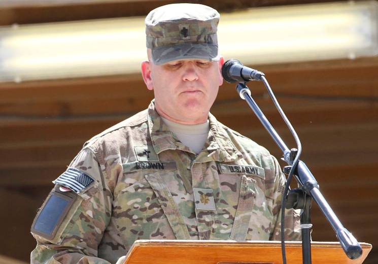 Maj. Rick Brown, chaplain with 4th Infantry Division, addresses a crowd of U. S. and NATO service members and civilians during a morning Regional Command (South) Memorial Day ceremony at Kandahar Airfield, Afghanistan, May 26, 2014. (U.S. Army photo by Sgt. 1st Class Brock Jones)